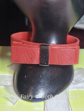 BCBGeneration "Bow Wow Wow" Coral Vegan Leather Bracelet.